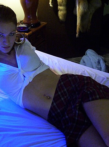 Vulgar description: This is a pic of some bitch with her skirt up, laying on a fuckin' bed.