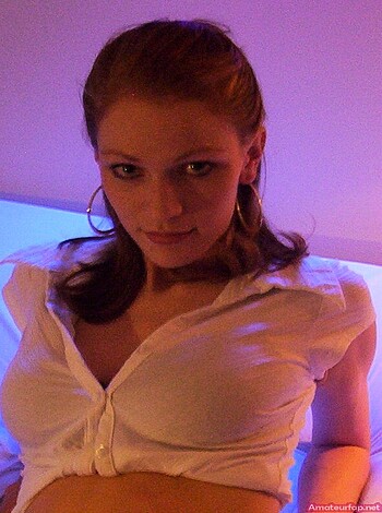 A busty broad with her tits and belly hanging out is the image description that needs to be written here.