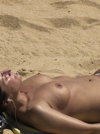 """
A titty-fucking bitch lying out on some fucking sand.
"""