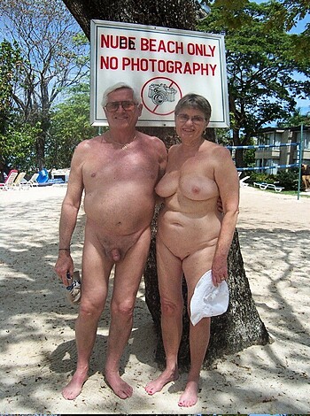 Two old folks fuckin' near "Retirement Community" sign.