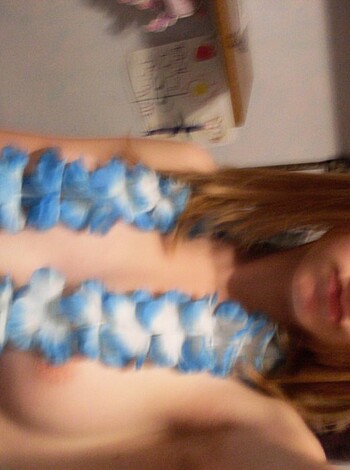 "Here's a fuckin' hot chick, lookin' all goddamn sexy in her blue flowered lei. You wanna take a gander at this shit?"