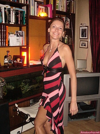 Here's a babe with her vagina hanging out of some frilly ass shit, giving you the cheesy smile that tells you she wants to fuck.