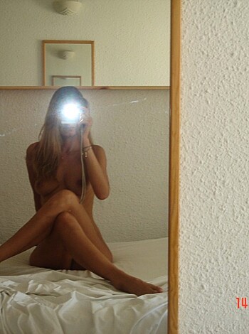 Look at this fucking hot bitch taking a selfie with her tits and ass hanging out.
