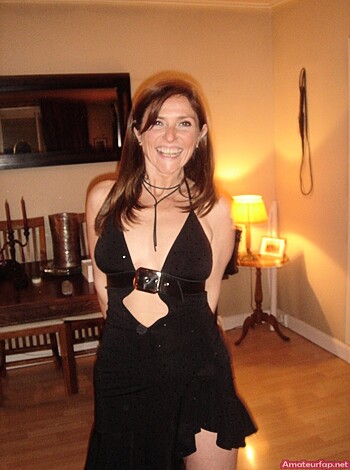 A photo of some bitch in a fucking tight ass dress, showin' her tits and belly like who the fuck cares