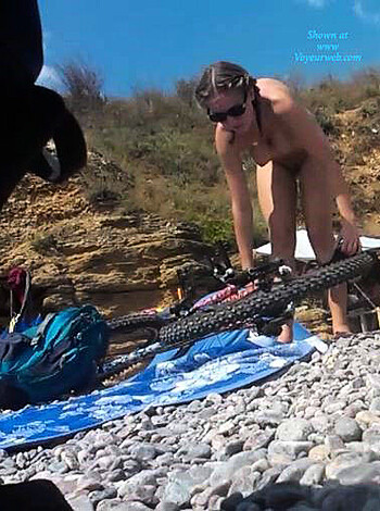 Look at this bitch with her fucking shades and skimpy thong on a sunny day, man. Damn!