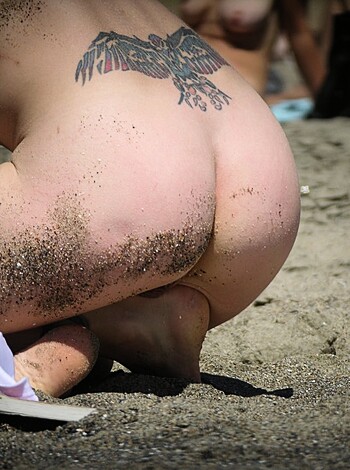 Here's a fucking picture of some hot chick's ass, with her asshole poking out, getting sand fucked up in her crack while she's lying on a beach with no clothes on.