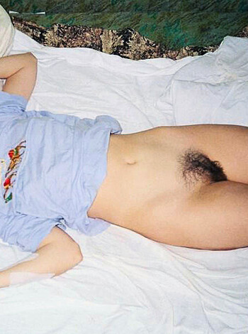 Armpit hair and bush on full display from a naked bitch.