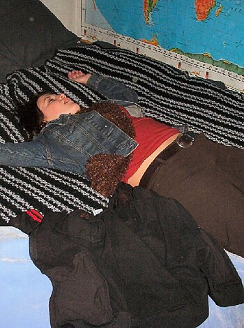 """
Here's a close-up shot of some chick reppin' some fucking sweet striped bedsheets while sporting a badass jean jacket on her back. This picture basically encapsulates the definition of cozy AF. 
"""