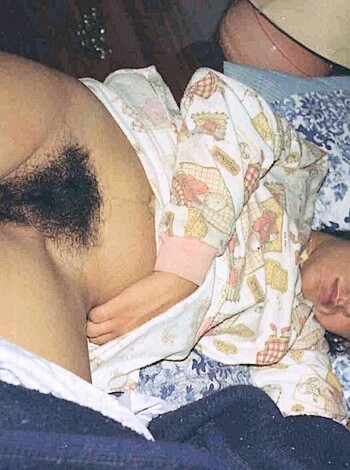 A naked bitch lies on her belly with flowing locks dangling over her body, spread eagle for your viewing pleasure.