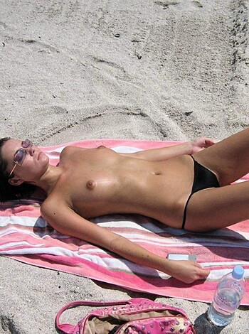 "Busty bitch straddles sun lounger with no fucking top on."