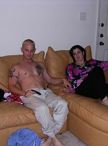 "This picture shows two naked chick and dude bumming on the sofa."