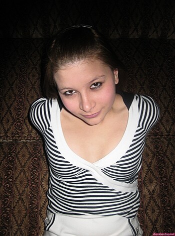 """
Busty broad with stripey tee, showing tits for the camera.
"""