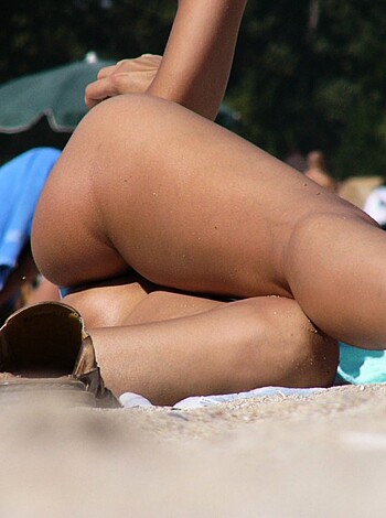 """
Sexy nude booty of babe on shore.
"""