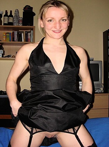 """
A naked ass bitch with her tight black dress and saggy panties exposed.
"""