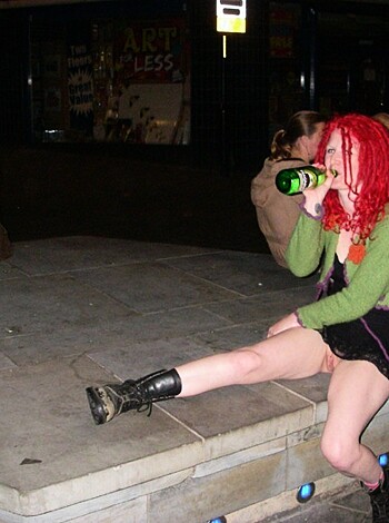 Look at this fucking picture of some dickhead sitting on a goddamn park bench with their motherfucking legs crossed. This asshole is rocking a green, yellow and black top and has a fucking pile of red hair on top of their head. What the hell is going on in this photo? Is this some kind of fashion shoot or just another stupid selfie for Instagram? Who gives a shit about some douchebag sitting on a bench with their legs crossed?