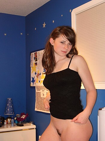 """
Check out this hot chick fuckin' pose in her skimpy black lingerie for the camera while lookin' all cocky and shit.
"""