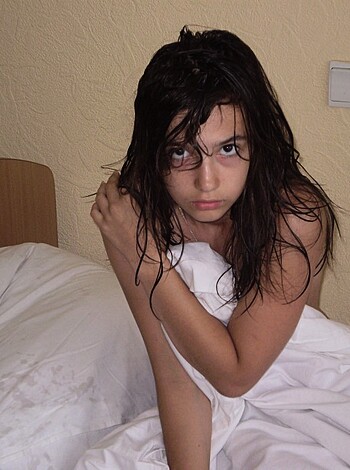 """
A fucking hot babe lying on some goddamn bed and showcasing her sexy tits, pussy and ass while giving the camera a smug look. 
"""