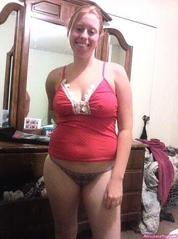 "This picture shows a hot chick in a sexy red bikini bottoms and a tight white bra, check out her perfect tits."