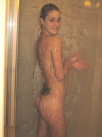 Here's a naked chick, pissing on herself while taking a shit.