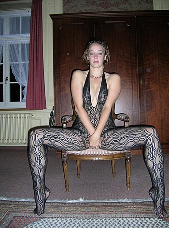 "Here's an image of some hot babe in sexy panties, chillin' in a chair."