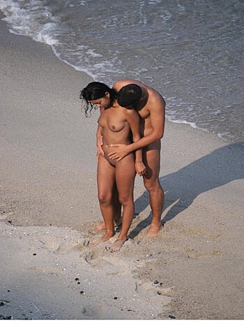 Fucking naked bitch and bastard getting busy on sandy shore like they fuckin' own it, all sweaty and shit.