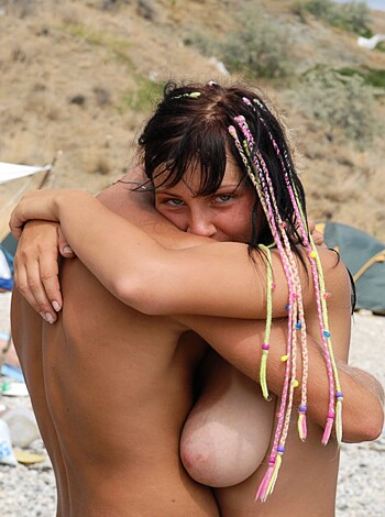 A fuckin' sexy dyke pussy-eating two hot bitches on a beach. One got colorful nigga locs while the other was sporting a tanned bod that made my dick hard.