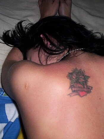 "Close-up of a dickhead's back tat of him sleeping nude on a fuckin' bed."