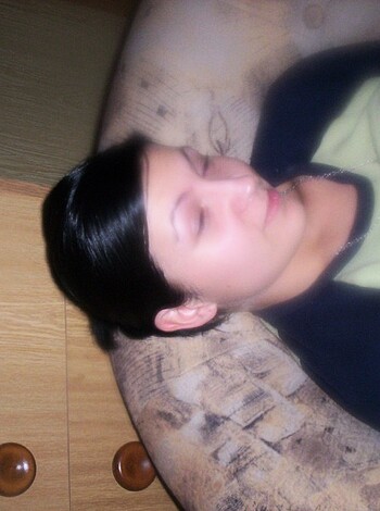 "This image shows a fuckin' chick passed out with her mouth open and her tits bouncin' on the bed."