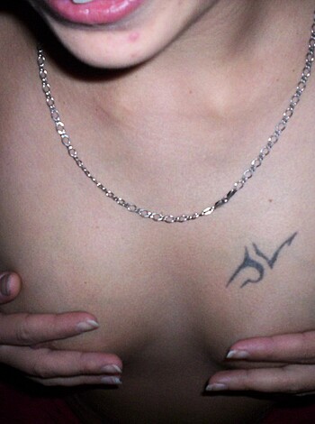 "Here's a shot of some chick with a tat on her rack and a fuckin' necklace."