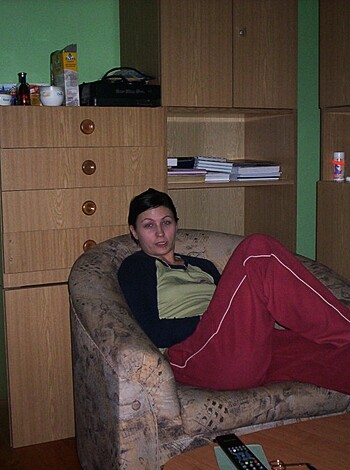 "Bitch sittin' on her ass with her legs open wide, wearin' red panties and a tight-assed t-shirt."