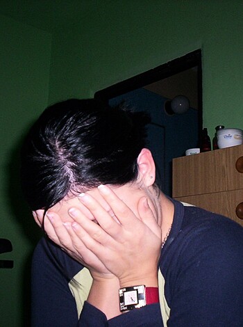 The fucking bitch has her fat fingers covering her goddamn face like she's trying to hide from someone or something. Fuck that shit, why won't she show her stupid mug?