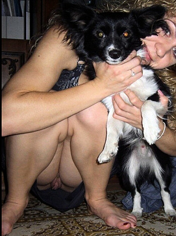 "Here's an uncensored view of a hot chick holding a canine with no clothes on."
