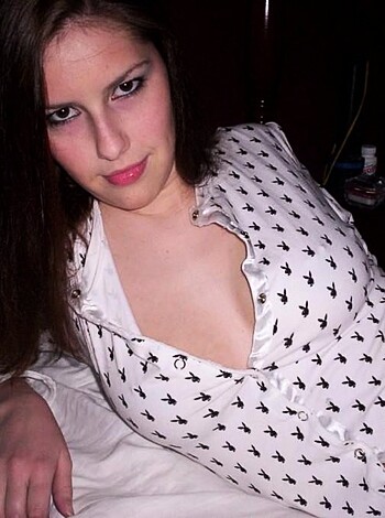 A chick dressed in polka dots, spread eagle on her backside.