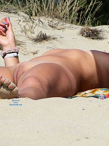 """
Gorgeous tits and ass bitch is taking a nap on the fucking beach, coated with hot sand.
"""