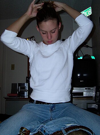 Vulgar Description: 
"Here's a hot blonde bitch stroking her hairy pussy while sitting on a couch wearing tight jeans and a button-down shirt."