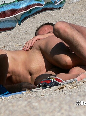 """
Two dudes fucking on a sandy shore.
"""