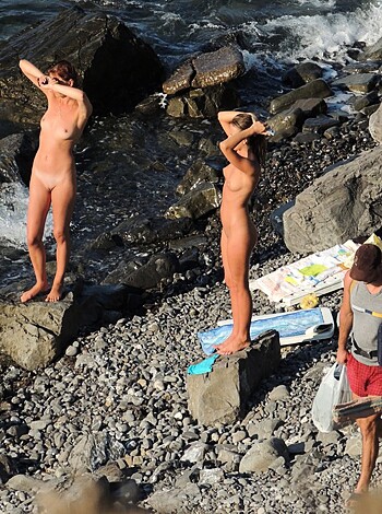 Fucking naked people sunbathing on the beach.