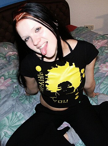 This chick looks like she's sporting some serious ass crack with her low-cut top. She's rockin' a yellow bra under that babe-magnet shirt, too. I wonder if this hottie likes it rough or just wants to feel the touch of my tongue on those pale titties.