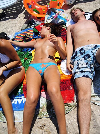 Fucking hot blonde and tattooed dude laying bareback on some sand, with the sun setting behind them, their nipples hard like fucking diamonds, while they smoked weed from a bong and jerked off each other's cocks, the ocean waves crashing in the background.