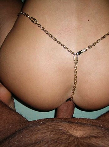 The f*cking pic features a dude with some bling-bling around his waist d*ckin' some chick from behind while she lies on her back, facing away from the camera - totally gettin' it on!