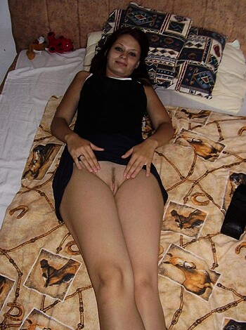 Here's a description of a woman's panties being pulled down by her legs, exposing her fucking vagina.