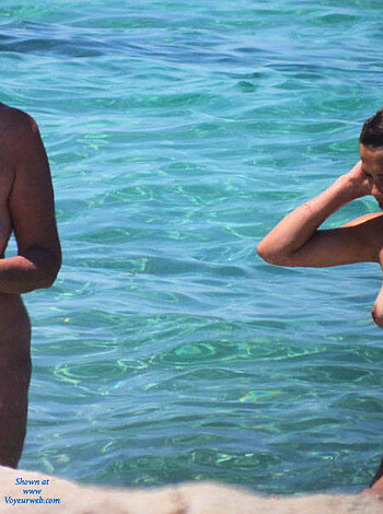Fucking two chicks getting naked and swimming topless at the fuckin' shore, yo!
