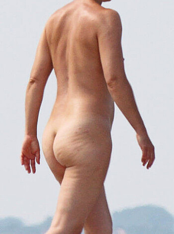 "Check out this dick-tattooed dude, strolling down the sandy shore with his junk hangin' out like a goddamn fuckin' pecker parade."