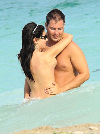 A pair of fucking nude assholes making out in the goddamn sea like a bunch of slimy motherfuckers.