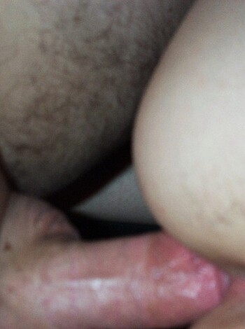 This image depicts a dude eating out a woman's pussy with his mouth.