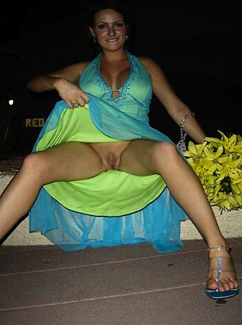 Vulgar, factual description: "Look at this naked bitch squatting on the sidewalk with her cunt fully exposed."