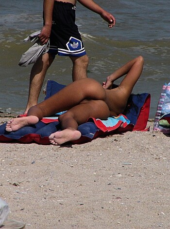 "Damn hot bitch spread her ass on a fuckin' towel at the fuckin' beach."