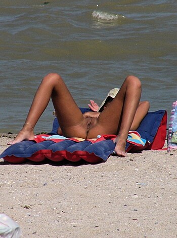 "You ever see that bitch with her tits out, fryin' her nipples like hot dogs? Yeah man, she was chillin' nude ass-nekkid on the sandy shore, gettin' her tan on. Shit was sexy as hell."