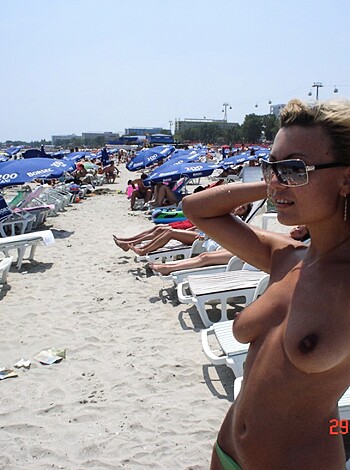 "Here's the photo of some fat tits bitch in her birthday suit, pose on beach."