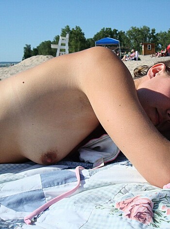 "Look at this dumb bitch laying out on the sand with her tits hanging out and shit."